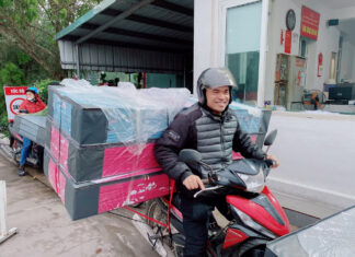 A “squad” carrying mattresses back home for Tet holidays