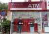 Contrasting Scenarios at ATM Booths on the Eve of Lunar New Year.