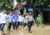 A Helping Hand: PM Phạm Minh Chính Wades Through Mud to Encourage Yên Bái Residents
