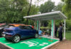 “The Race to Electric Vehicle Charging Stations Heats Up: Billionaire Phạm Nhật Vượng’s Company Aims to Transform Supermarkets and Cafes into Charging Hubs, with a Utility Sector Giant Poised to Join the Fray.”