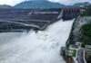 Optimizing Hydropower Reservoir Operations to Mitigate Downstream Flooding