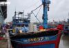 Fishing Boats Flock to Shore as Fishermen Rush to Sell Seafood Ahead of Typhoon Bualoi