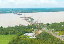 Spectacular Milestone Achieved: Vietnam’s Second-Longest Main Span Bridge, Featuring a Tower Equivalent to a 35-Story Building, Surpasses Construction Timeline
