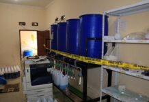 Raid on Silk Screen Printing Facility Leads to Shocking Discovery: Police Bust Counterfeit Detergent Ring, Seize Hundreds of Plastic Cans Filled with Chemicals and Industrial Mixing Machines