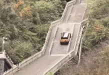 Chinese SUV Plunges Down Cliff, Smashing Railing After Attempting to Climb 999 Steps to Mountain Peak